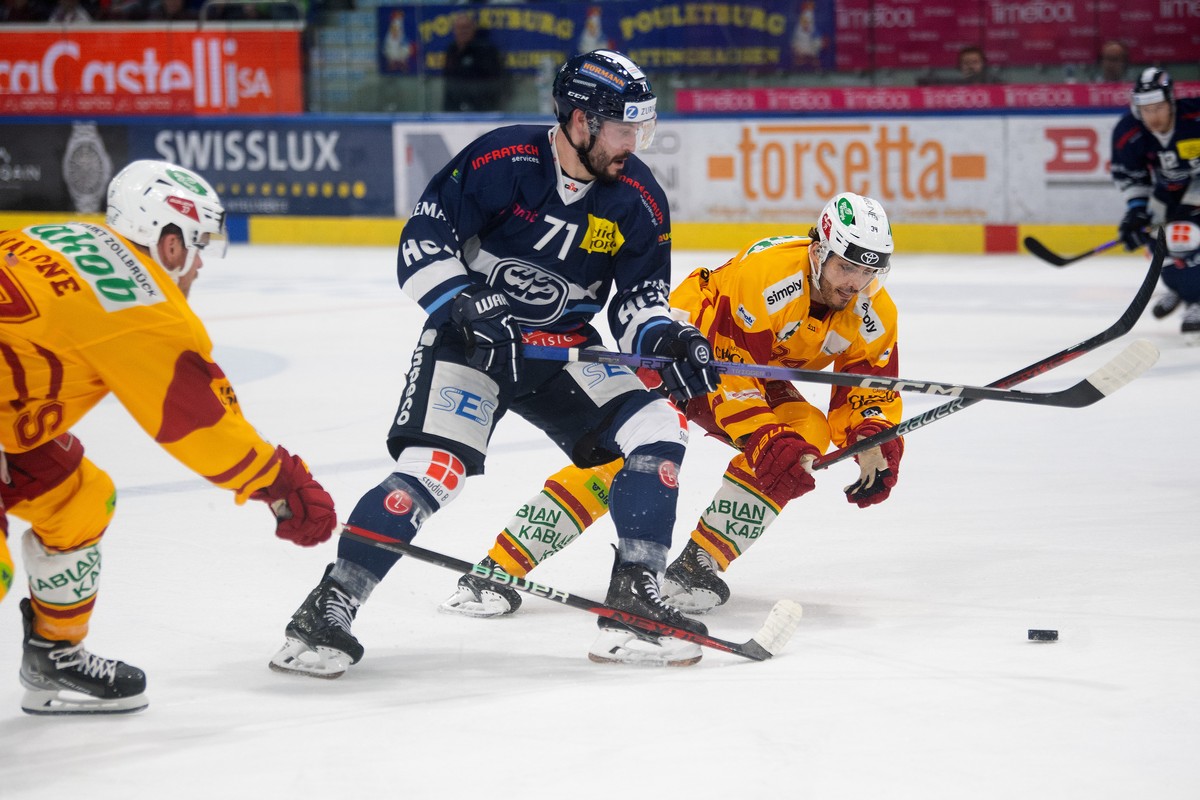 From left, Tiger's player Sean Malone, Ambri's player Jesse Virtanen and, Miro Zryd, during the preliminary round game of National League A (NLA) Swiss Championship 2023/24 between, HC Ambri ...