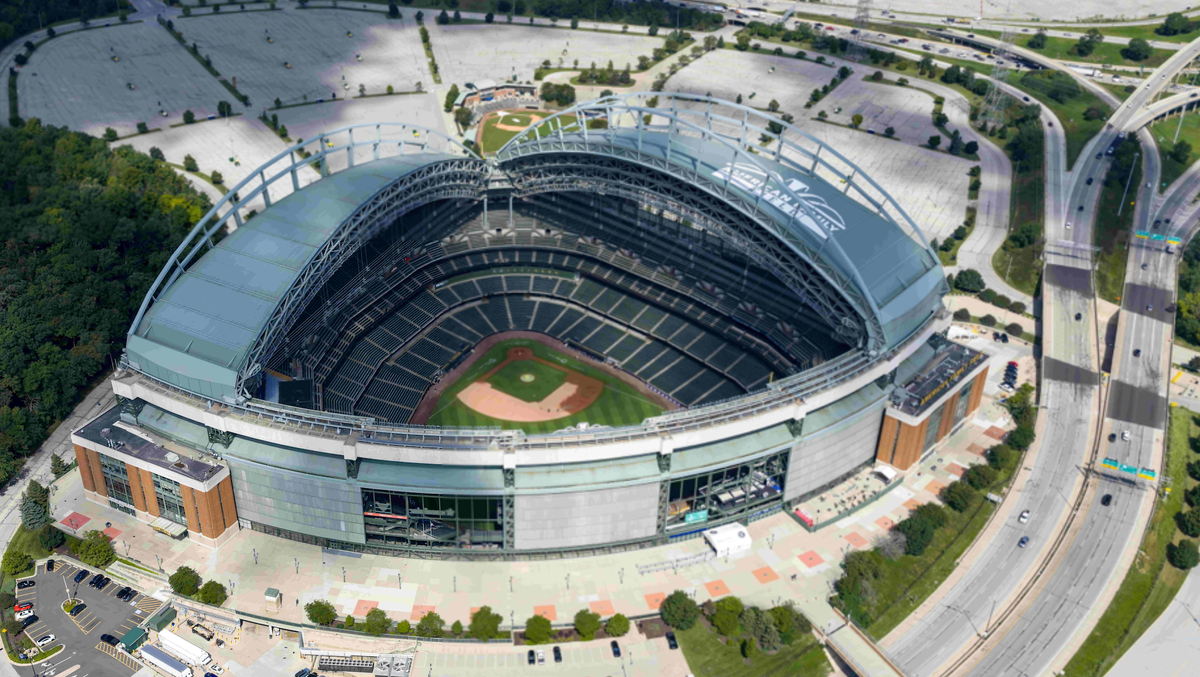 August 22, 2025, Milwaukee, Wi, USA: Aerial view of American Family Field in Milwaukee, with its iconic fan-shaped retractable roof open, revealing the home of the Brewers nestled near I-94, surrounde ...