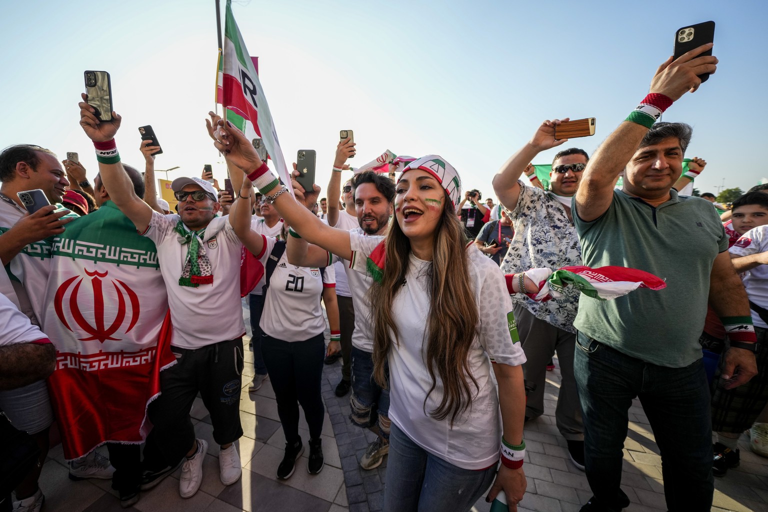 Iranian fans react after their team's win against Wales after the World Cup group B soccer match between Wales and Iran, at the Ahmad Bin Ali Stadium in Al Rayyan , Qatar, Friday, Nov. 25, 2022. (AP P ...