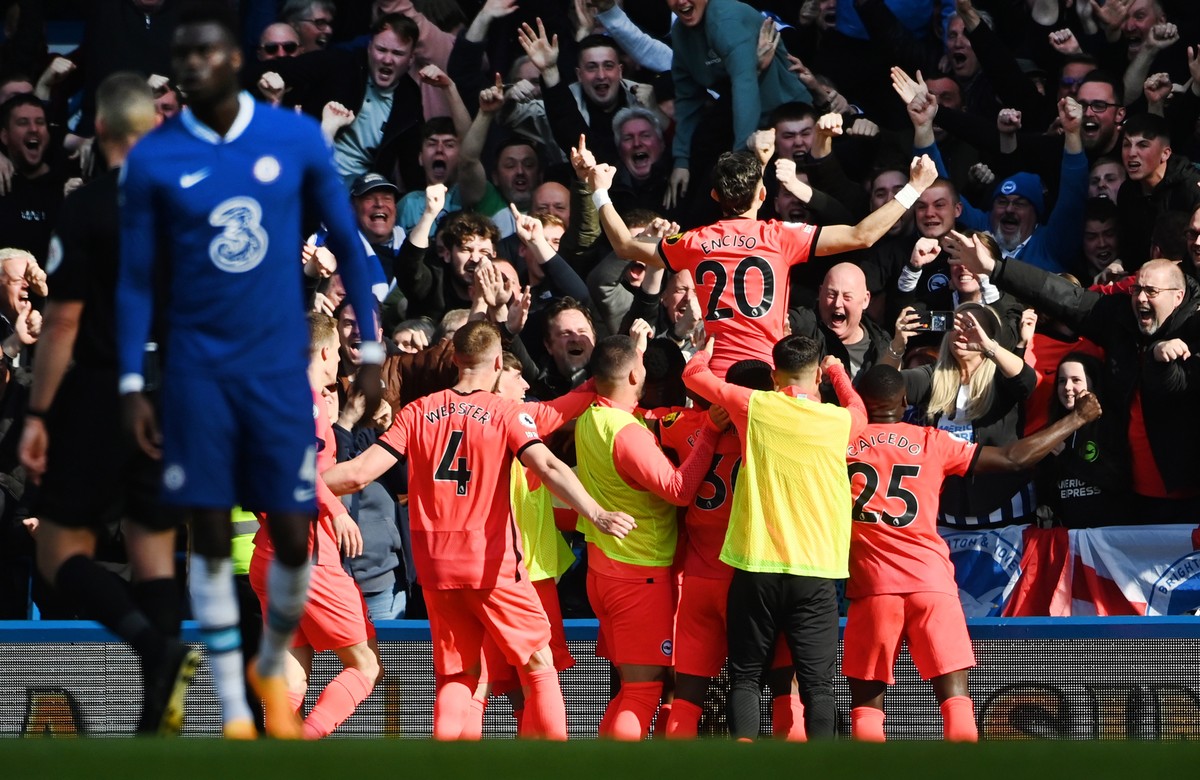 epa10573961 Brighton's Julio Enciso (top) celebrates after scoring the 2-1 lead against Chelsea during the English Premier League soccer match between Chelsea and Brighton and Hove Albion at Stam ...