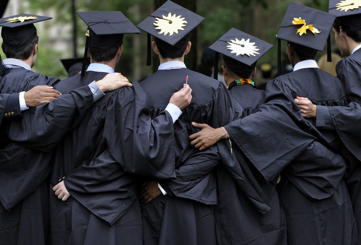 FILE - In this May 20, 2013 file photo, graduates pose for photographs during commencement at Yale University in New Haven, Conn. There's still plenty of pomp and circumstance, inspiring words fr ...