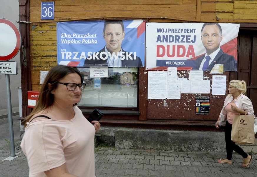 Campaign posters for two contenders in Poland&#039;s key presidential election runoff Sunday, incumbent conservative president, Andrzej Duda, who is seeking reelection, and his liberal rival, Warsaw m ...