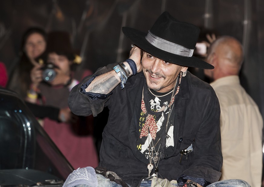 Actor Johnny Depp arrives at the Glastonbury music festival at Worthy Farm, in Somerset, England, Thursday, June 22, 2017. (Photo by Grant Pollard/Invision/AP)