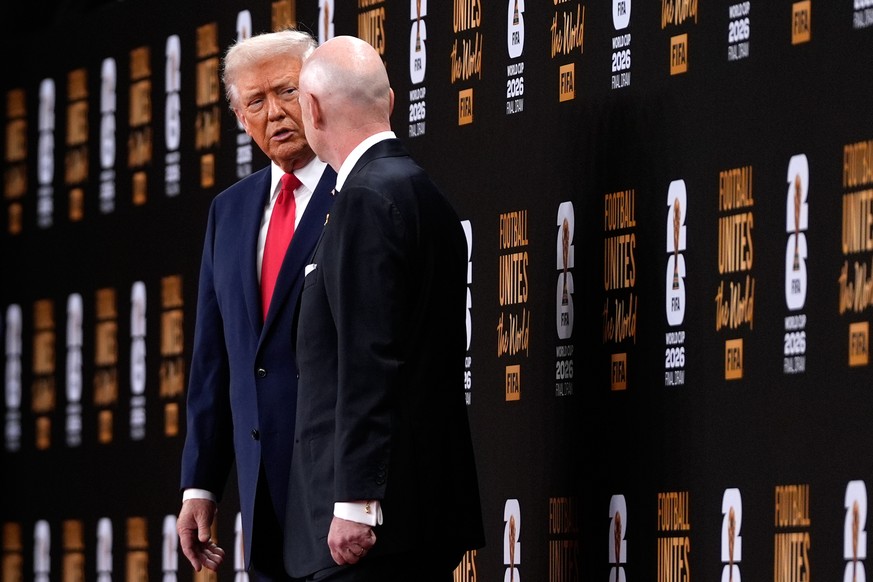 President Donald Trump speaks with FIFA President Gianni Infantino as they leave after the draw for the 2026 soccer World Cup at the Kennedy Center in Washington, Friday, Dec. 5, 2025. (AP Photo/Julia ...