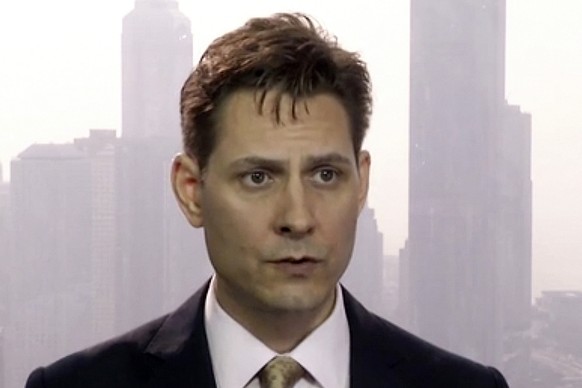 FILE - In this March 28, 2018, file image made from video, Michael Kovrig, an adviser with the International Crisis Group, a Brussels-based non-governmental organization, speaks during an interview in ...