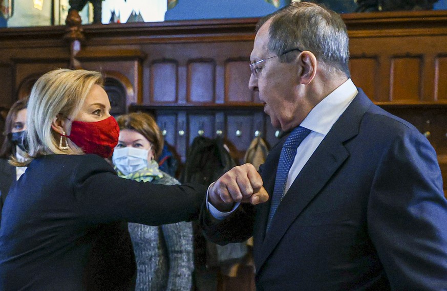 In this handout photo released by Russian Foreign Ministry Press Service, Russian Foreign Minister Sergey Lavrov, right, and British Foreign Secretary Liz Truss greet each other prior to their talks i ...