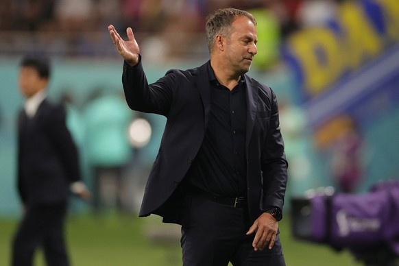 epa10322855 Hansi Flick, head coach of Germany, reacts during the FIFA World Cup 2022 group E soccer match between Germany and Japan at Khalifa International Stadium in Doha, Qatar, 23 November 2022.  ...