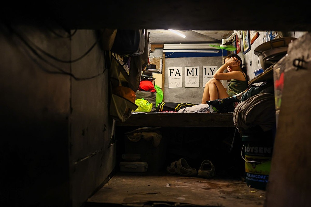 MANILA, PHILIPPINES - MARCH 23: A woman in her room, inside a tunnel beneath a highway where 100 families live, in Manila, Philippines, March 23, 2026. Around 100 homeless families, about 300 people i ...