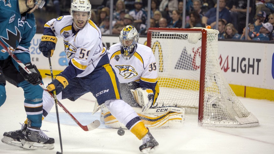 May 1, 2016; San Jose, CA, USA; San Jose Sharks center Tomas Hertl (48) attempts to shoot the puck against Nashville Predators goalie Pekka Rinne (35) while being defended by defenseman Roman Josi (59 ...