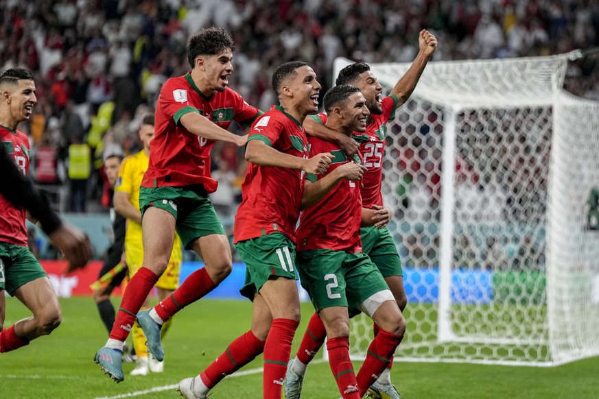 Morocco&#039;s players celebrate their victory over Spain during the World Cup round of 16 soccer match between Morocco and Spain, at the Education City Stadium in Al Rayyan, Qatar, Tuesday, Dec. 6, 2 ...