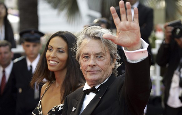 FILE - French actor Alain Delon and model Bianca di Sofia arrive for the screening of the film &quot;Chacun Son Cinema&quot; (&quot;To Each His Own Cinema&quot;), at the 60th International film festiv ...