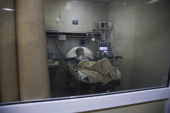 A COVID-19 patient lies on a bed of the Mexico City Ajusco Medio General Hospital ICU ward, Wednesday, Dec. 2. 2020. Mexico continues to report an increase in the number of coronavirus cases, with Mex ...