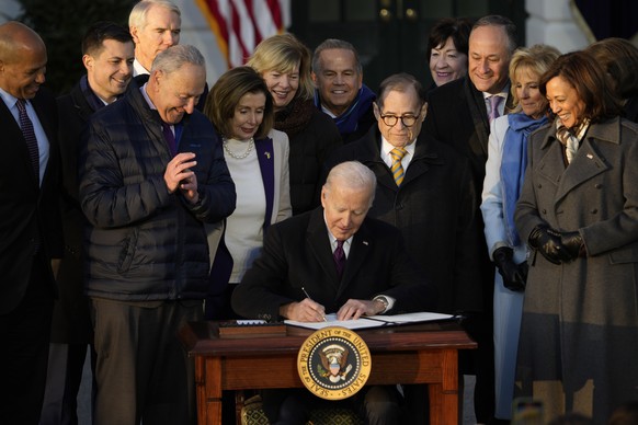 President Joe Biden signs the Respect for Marriage Act, Tuesday, Dec. 13, 2022, on the South Lawn of the White House in Washington. (AP Photo/Andrew Harnik)
Joe Biden