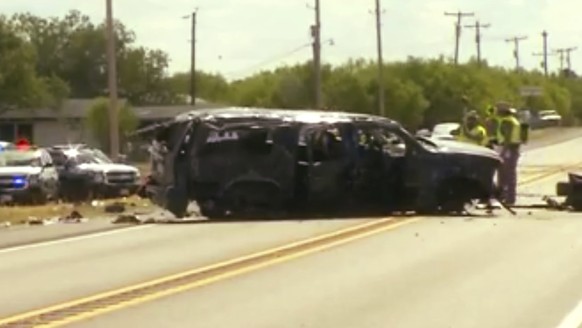 This frame grab from video provided by KABB/WOAI in San Antonio shows the scene on Texas Highway 85, where authorities say multiple people are dead and others hurt as an SUV carrying more than a dozen ...