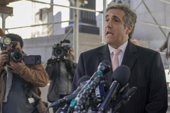 Donald Trump's former attorney and fixer Michael Cohen speaks to reporters after a second day of testimony before a grand jury investigating hush money payments he arranged and made on the former p…