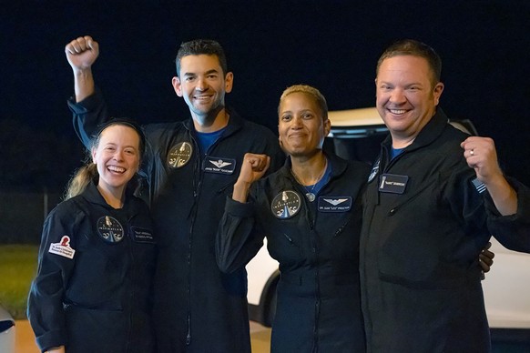 In this image released by Inspiration4, passengers aboard a SpaceX capsule, from left to right, Hayley Arceneaux, Jared Isaacman, Sian Proctor and Chris Sembroski pose after the capsule was recovered  ...