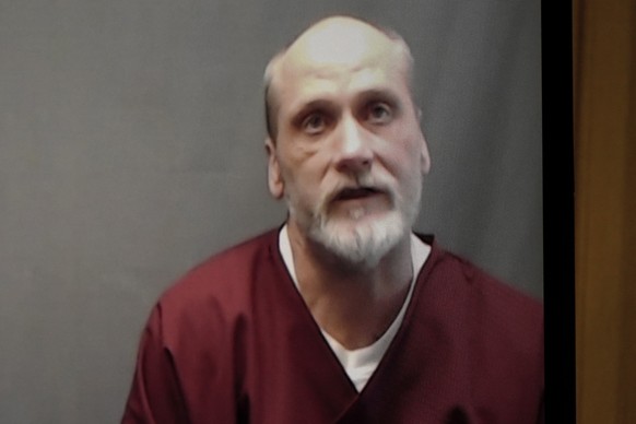 FILE - In this photo from a video screen, death row inmate James Coddington speaks to the Oklahoma Board of Pardon and Parole on Wednesday, Aug. 3, 2022, in Oklahoma City. Oklahoma Gov. Kevin Stitt ha ...
