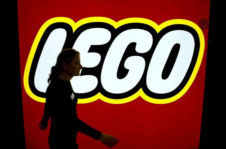 epa04383693 (FILE) A file photo dated 01 February 2007 showing a woman walking past the Lego logo at the toy fair in Nuremberg. Danish toy company Lego on 04 September 2014 reported an 11-per-cent ris ...