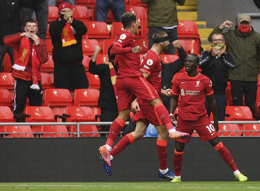 Liverpool&#039;s Sadio Mane, right, celebrates scoring his sides first goal during the English Premier League soccer match between Liverpool and Crystal Palace at Anfield stadium in Liverpool, England ...
