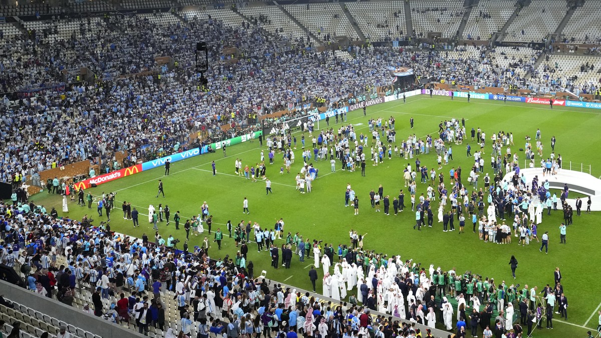 Argentina's players celebrate with supporters after the awarding ceremony at the end of World Cup final soccer match between Argentina and France at the Lusail Stadium in Lusail, Qatar, Sunday, D ...