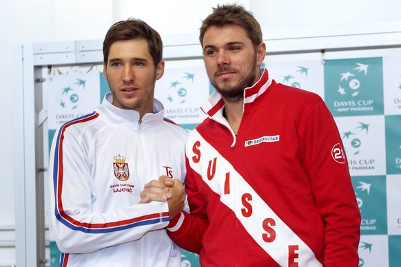 epa04048449 Dusan Lajovic, left, of Serbia, poses with Stanislas Wawrinka, right, of Switzerland, for the photographers after the drawing for Davis Cup prior to the Davis Cup World Group first round m ...