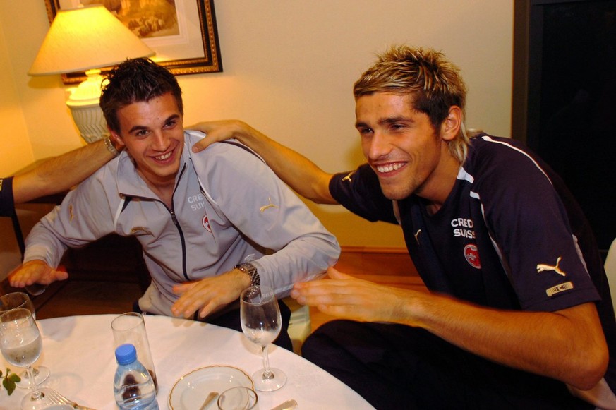 Swiss national team soccer players Valon Behrami, right, and Eldin Jakupovic, right, cheer at the team&#039;s hotel after the FIFA 2006 qualifying play-off second leg soccer match between Turkey and S ...