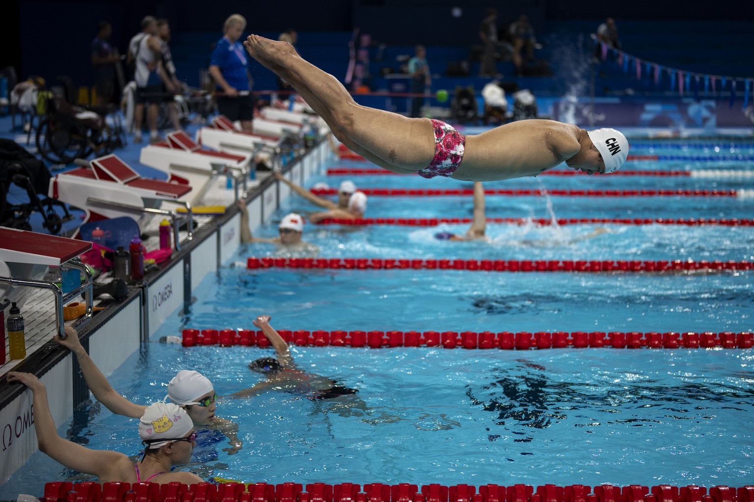 Wang Linchao, from China, jumps into the pool during a warmup session ahead of the 2024 Paralympics, Tuesday, Aug. 27, 2024, in Paris, France. (AP Photo/Emilio Morenatti)