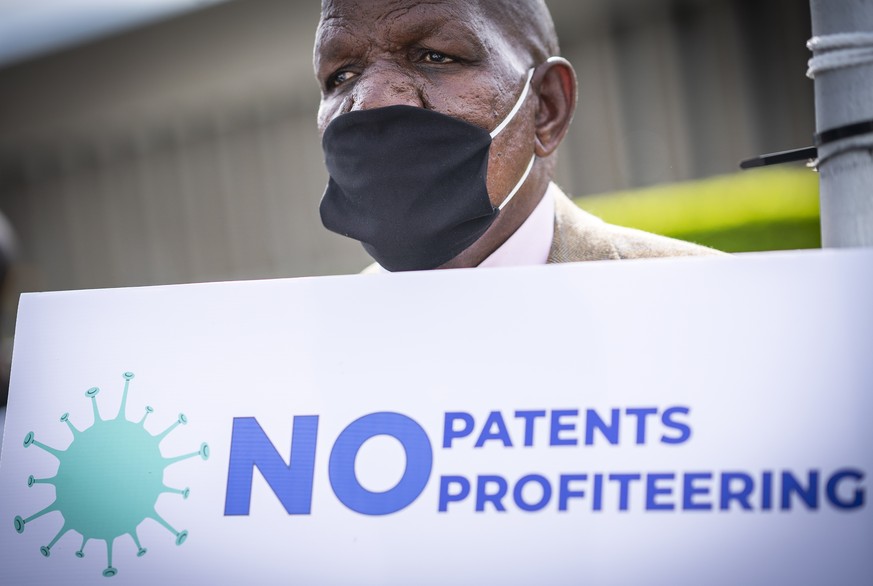 epa09067206 A member of the People&#039;s Vaccine Campaign of South Africa (PVC-SA) protests outside the Johnson &amp; Johnson offices in Cape Town, South Africa, 11 March 2021. The People&#039;s Vacc ...
