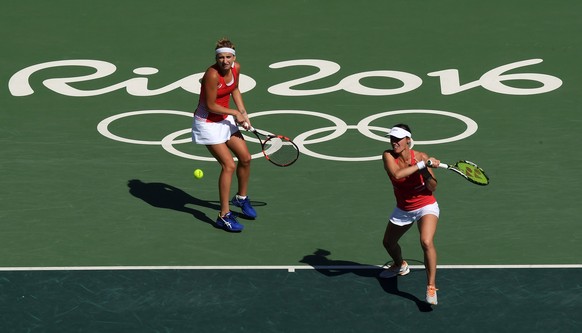 2016 Rio Olympics - Tennis - Final - Women&#039;s Doubles Gold Medal Match - Olympic Tennis Centre - Rio de Janeiro, Brazil - 14/08/2016. Martina Hingis (SUI) of Switzerland and Timea Bacsinszky (SUI) ...