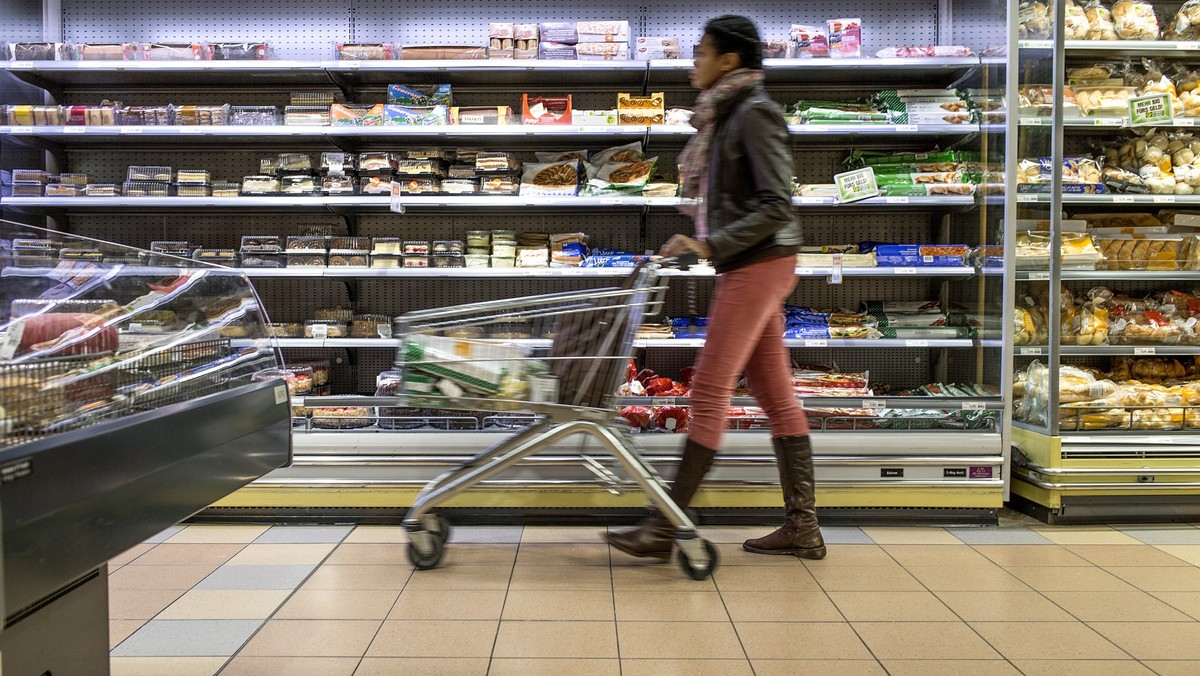 A customer pushes a supermarket trolley past the refrigerated shelf, pictured on March 5, 2013, at the Migros branch in Baden, Switzerland. Migros is Switzerland's the largest retail company. (KE ...