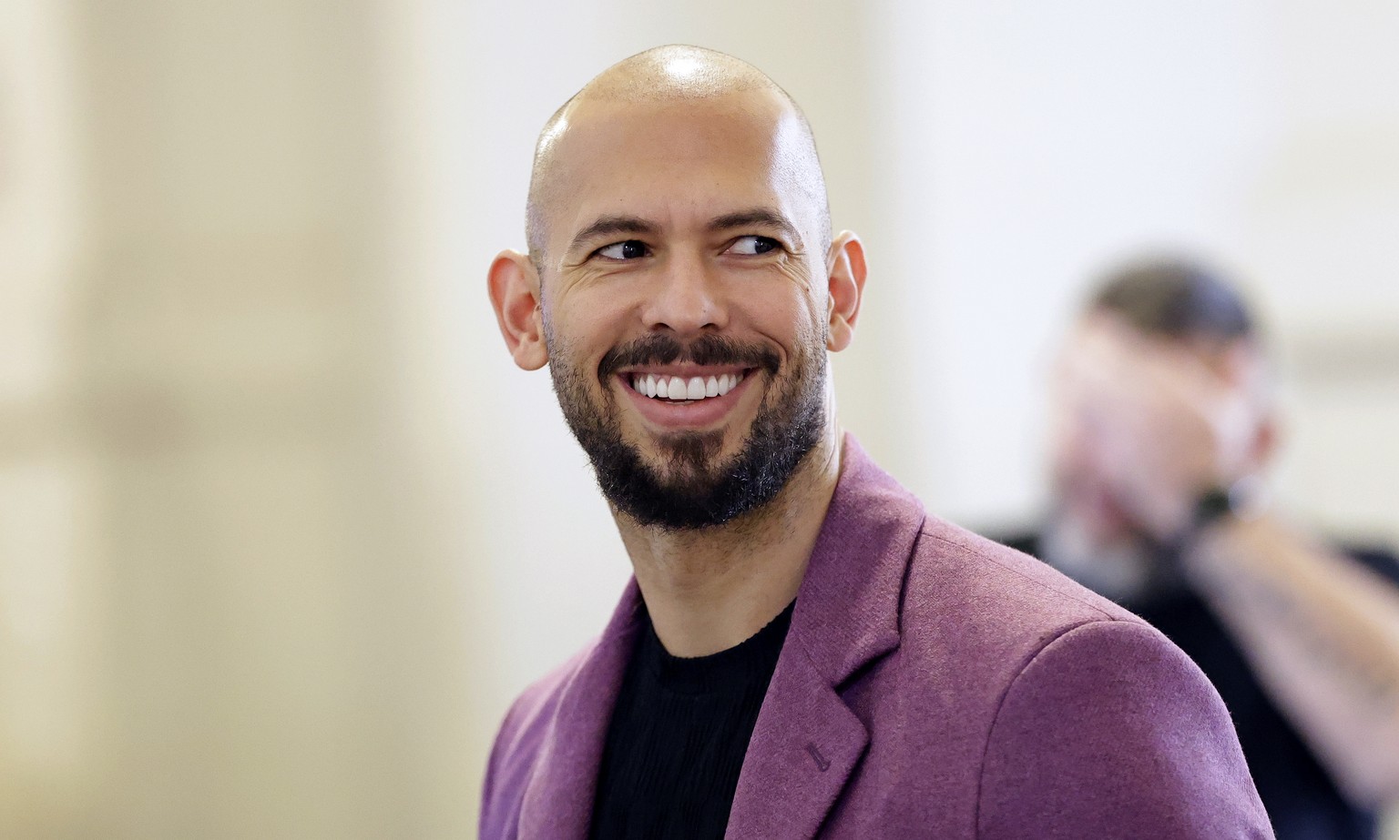 epa11768431 Former professional kickboxer and social media influencer Andrew Tate arrives for a preliminary appeal hearing held at the Bucharest Appeal Court in Bucharest, Romania, 10 December 2024. A ...