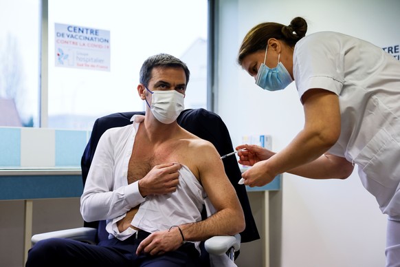 French Health Minister Olivier Veran receives a dose of the AstraZeneca-Oxford COVID-19 vaccine at the South Ile-de-France Hospital Group in Melun, in the outskirts of Paris, Monday Feb. 8, 2021. Fren ...