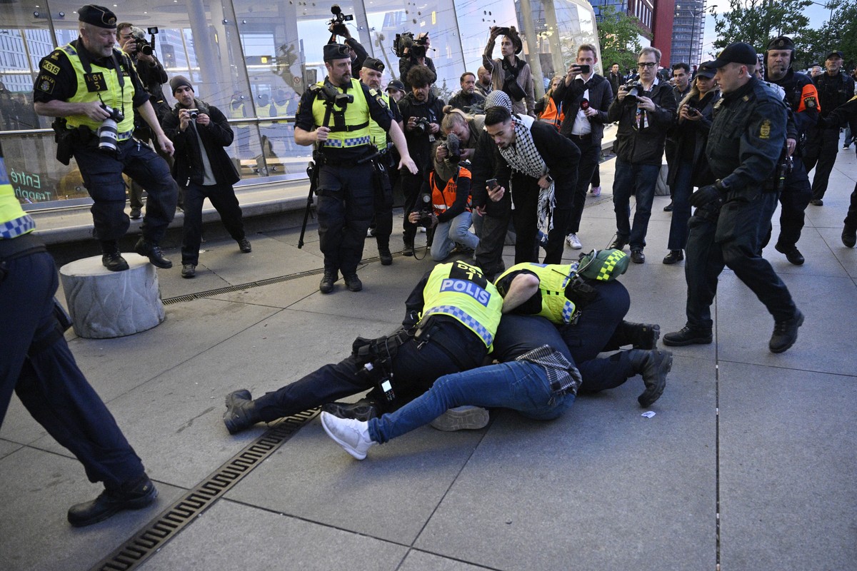 Police block a man during a protest against the participation of Israeli contestant Eden Golan ahead of the final of the Eurovision Song Contest in Malmo, Sweden, Saturday, May 11, 2024. Israeli conte ...