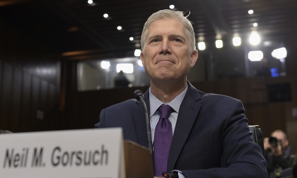 FILE - In this March 21, 2017, file photo Supreme Court Justice nominee Neil Gorsuch prepares to testify on Capitol Hill in Washington, at his confirmation hearing before the Senate Judiciary Committe ...
