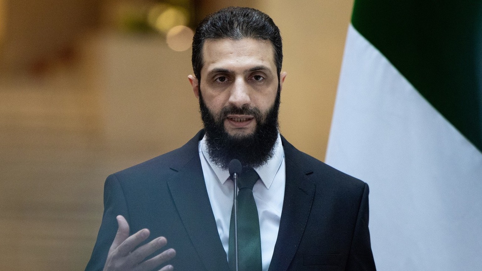 epa11790226 A handout photo made available by the Turkish Foreign Ministry Press Office shows Syria&#039;s rebel leader Ahmed al-Sharaa, also known as Abu Mohammed al-Jolani, attending a press confere ...