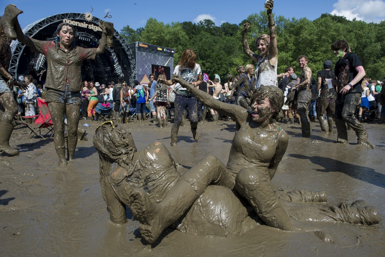 Festivalvisitors dancing in the mud during the OpenAir St. Gallen on Sunday, June 30, 2013, in St. Gallen. The OpenAir St.Gallen is one of the oldest outdoor festivals in Switzerland. It's close  ...