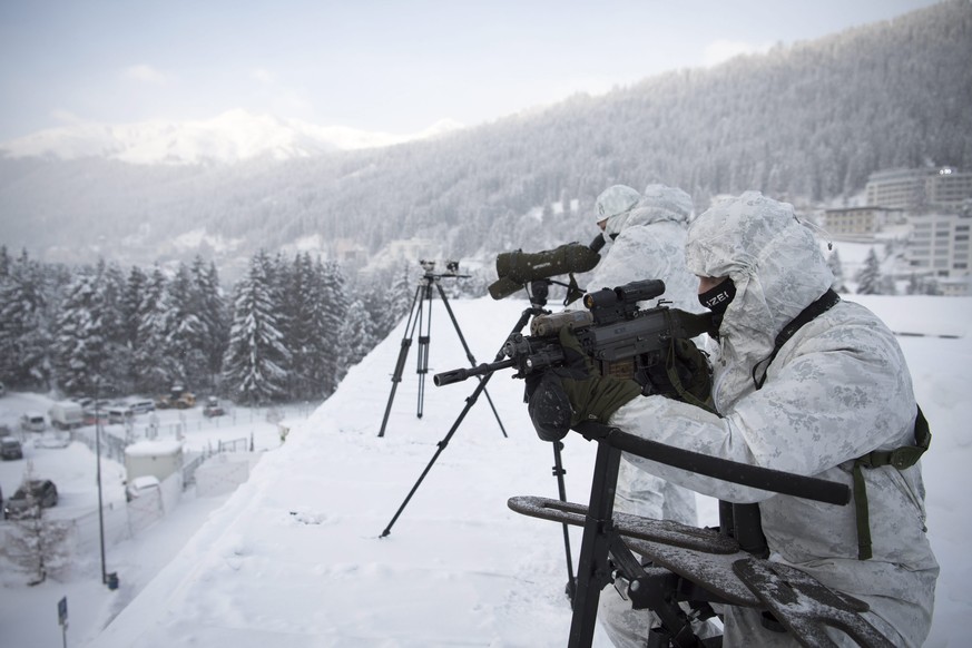 epa05720947 Police survey security from the roof of the Congress Centre on the eve of the 47th Annual Meeting of the World Economic Forum (WEF) in Davos, Switzerland, 16 January 2017. The annual meeti ...