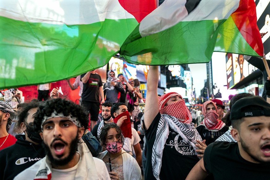 Supporters of the Palestinians march in New York Thursday, May 20, 2021. Israel and Hamas announced a cease-fire, ending a bruising 11-day war that caused widespread destruction in the Gaza Strip and  ...