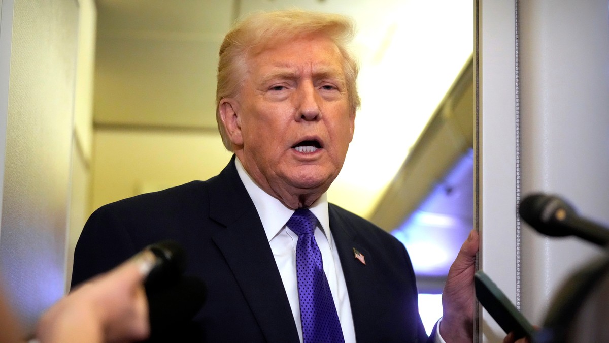President Donald Trump speaks to reporters as he flies aboard Air Force One from Joint Base Andrews, Md., to West Palm Beach, Fla., Friday, Feb. 6, 2026 (AP Photo/Mark Schiefelbein)
Donald Trump