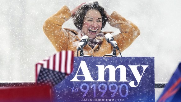 U.S. Sen. Amy Klobuchar wipes snow from her hair after announcing she is running for president of the United States, at Boom Island Park, Sunday, Feb. 10, 2019, in Minneapolis. Klobuchar joined the gr ...