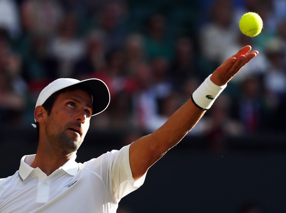 epa07692670 Novak Djokovic of Serbia serves to Denis Kudla of USA in their second round match during the Wimbledon Championships at the All England Lawn Tennis Club, in London, Britain, 03 July 2019. ...