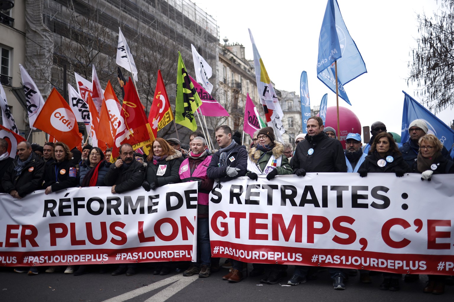 epa10415651 French trade unions leaders march behind a banner reading &#039;Pension?s reform, not a day longer&#039; during a national strike against the government&#039;s reform of the pension system ...