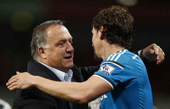Football - Arsenal v Sunderland - Barclays Premier League - Emirates Stadium - 20/5/15
Sunderland manager Dick Advocaat celebrates with Billy Jones at the end of the match after avoiding relegation
 ...