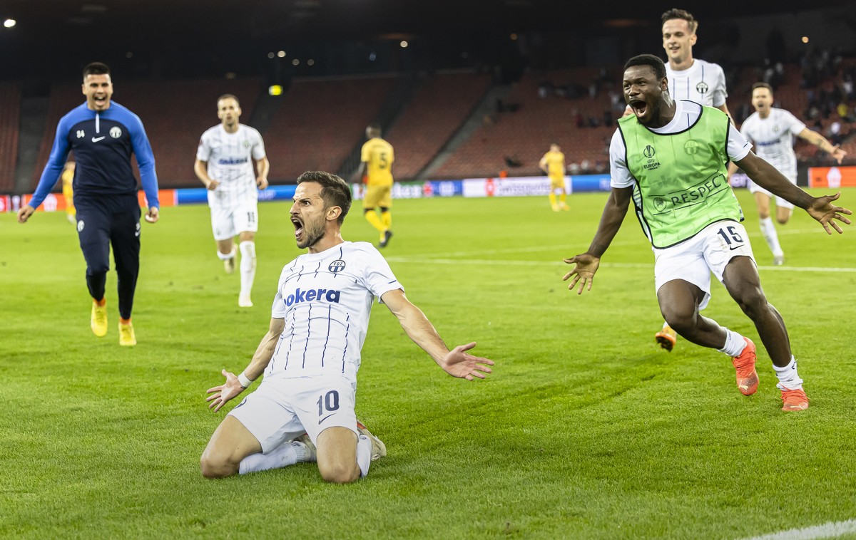 Zurich's Antonio Marchesano, center, celebrates with teammates after scoring his team's second goal of the match during the UEFA European League Group A soccer match between Switzerland' ...