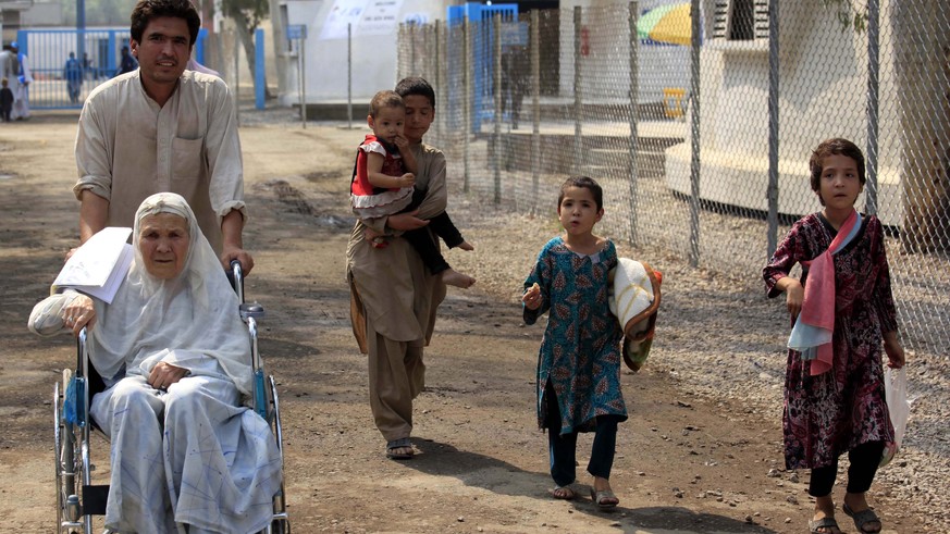 epa06825730 Afghan refugee to leave for Afghanistan, at a United Nations High Commissioner for Refugees (UNHCR) registration center on World Refugee Day in Nowshera, on the outskirts of Peshawar, Paki ...