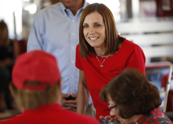 Arizona Republican senatorial candidate Martha McSally, speaks with voters, Tuesday, Nov. 6, 2018, at Chase&#039;s diner in Chandler, Ariz. McSally and Democratic challenger Kirsten Sinema are seeking ...