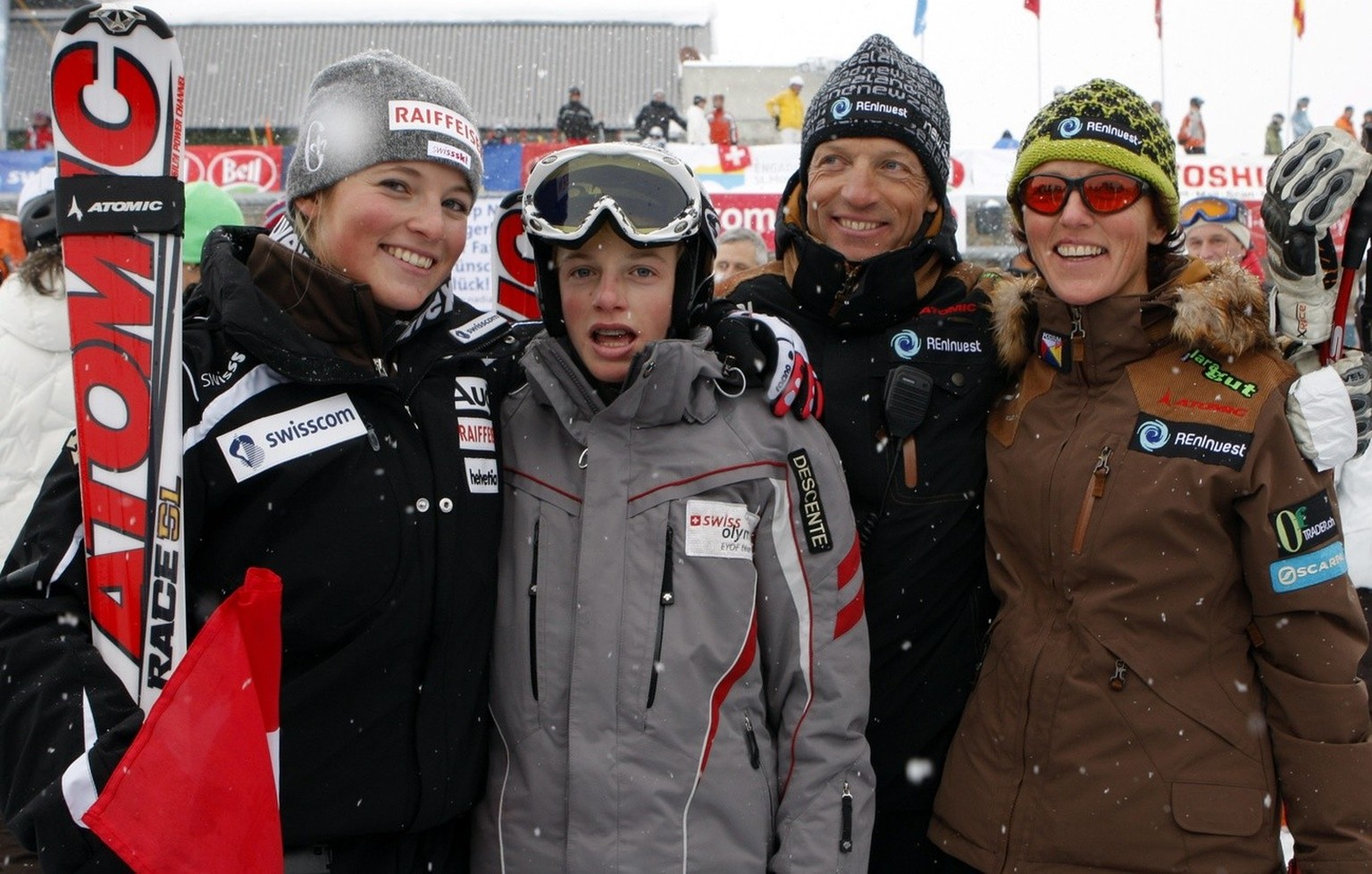 Switzerlands Lara Gut and her family brother Iann, father Paul and mother Gabriella, from left to right, celebrate her victory in the alpine ski Super G World Cup race in St. Moritz, Saturday, Decembe ...