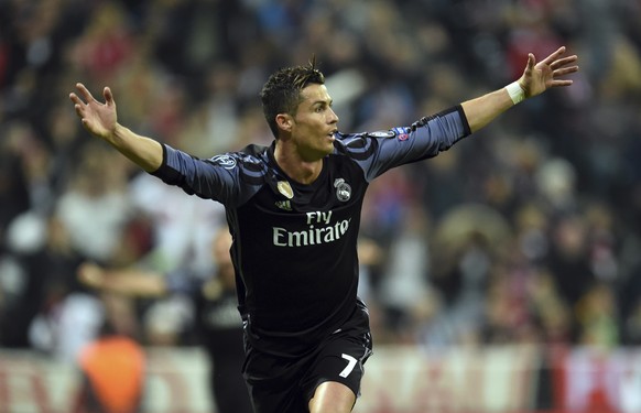 Real Madrid&#039;s Cristiano Ronaldo celebrates after scoring his side&#039;s 2nd goal during the Champions League quarterfinal first leg soccer match between FC Bayern Munich and Real Madrid, in Muni ...