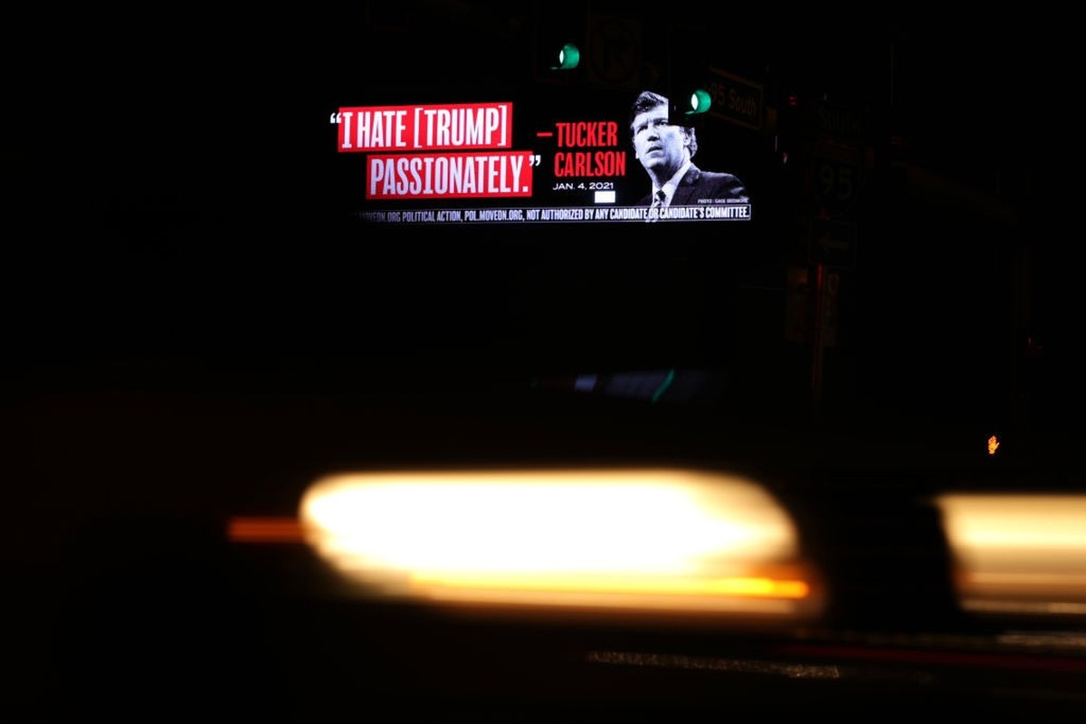 WEST PALM BEACH, FLORIDA - APRIL 02: A billboard put up by progressive activist group MoveOn that read “I Hate [Trump] Passionately - Tucker Carlson” is seen along I-95 on April 3, 2023 in West Palm B ...