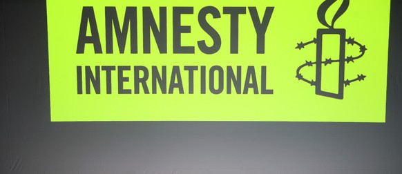epa10546246 (L-R) Campaigner for Amnesty International in Iran Nassim Papayianni delivers a speech next to Amnesty International France President Jean-Claude Samouiller, Secretary-General of Amnesty I ...